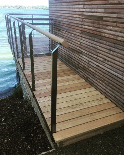 Bespoke built gate and stainless steel wire and balustrade with handrail